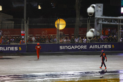 Kimi Raikkonen, Ferrari and Max Verstappen, Red Bull Racing walk back to the pits after their collision