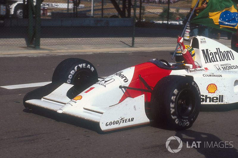 Ayrton Senna, McLaren MP4/7A Honda carries the Brazilian flag after his win