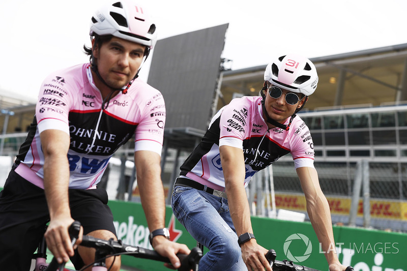 Esteban Ocon, Force India, Sergio Perez, Force India, take to the circuit on bicycles