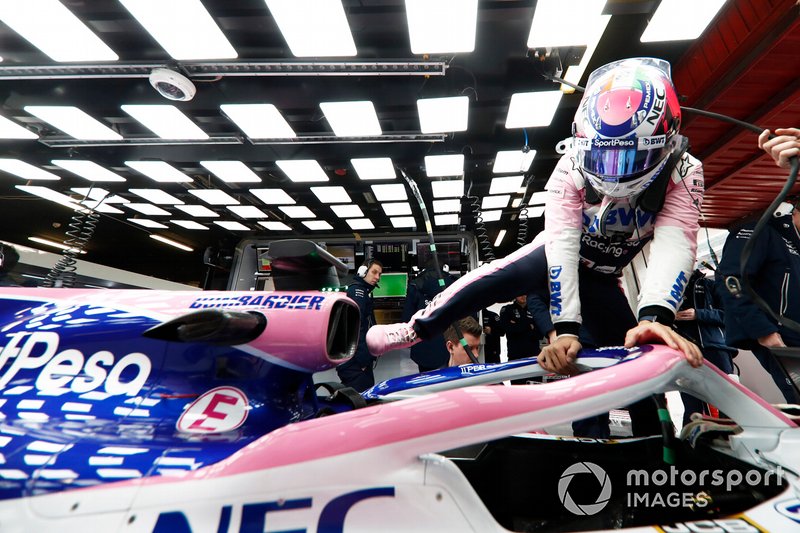 Sergio Perez, Racing Point RP19, climbs into his car in the garage