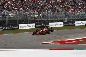 Sebastian Vettel, Ferrari SF71H and Carlos Sainz Jr., Renault Sport F1 Team R.S. 18 battle