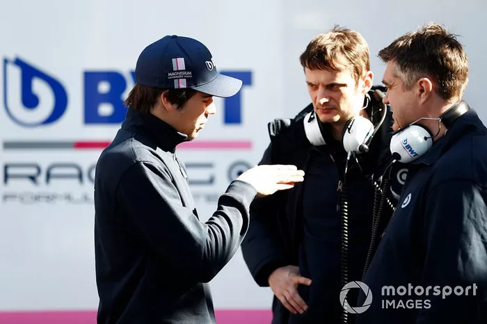 Lance Stroll, Racing Point talks to members of the team
