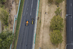 Fernando Alonso, McLaren MCL33 Renault, passes Carlos Sainz Jr., Renault Sport F1 Team R.S. 18