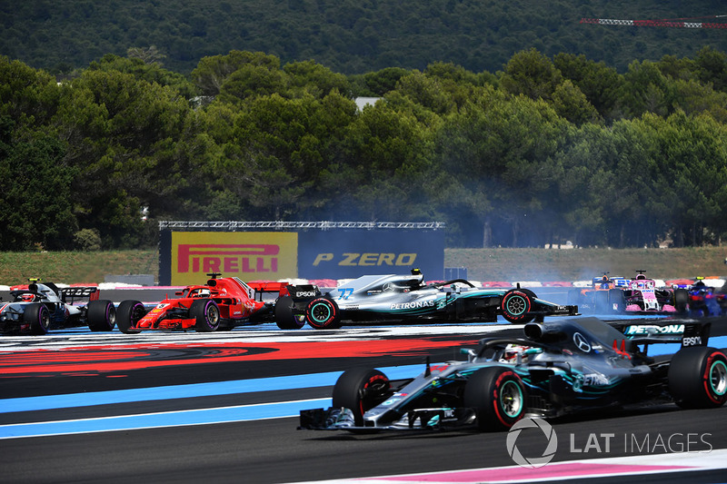 Lewis Hamilton, Mercedes-AMG F1 W09 leads at the start of the race as Sebastian Vettel, Ferrari SF71H hits Valtteri Bottas, Mercedes-AMG F1 W09