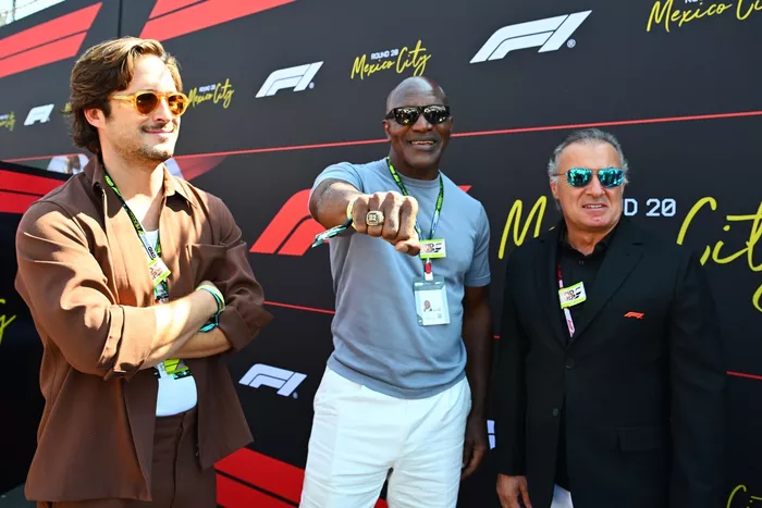 Evander Holyfield and Jean Alesi