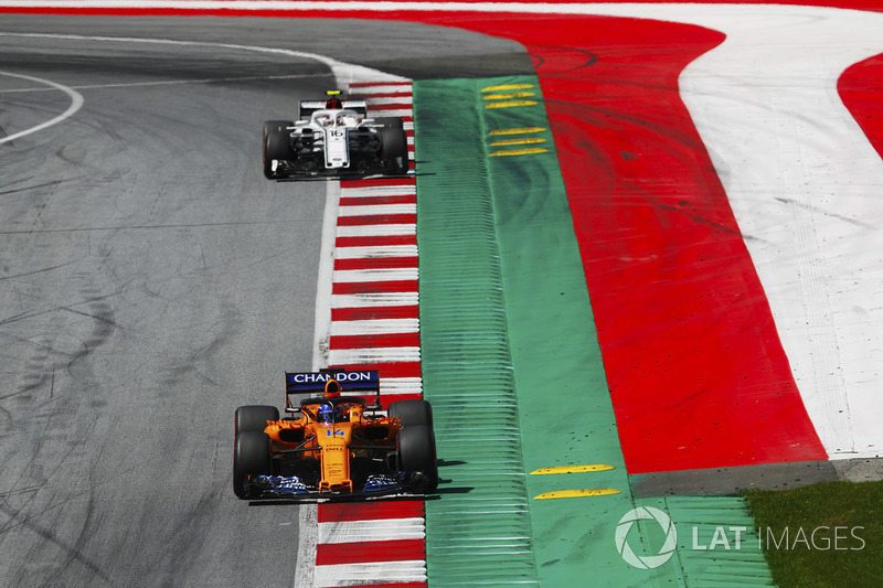 Fernando Alonso, McLaren MCL33, leads Charles Leclerc, Sauber C37, to the grid