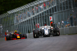 Marcus Ericsson, Sauber C37, leads Max Verstappen, Red Bull Racing RB14