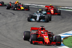 Sebastian Vettel, Ferrari SF71H, leads Valtteri Bottas, Mercedes AMG F1 W09, Kimi Raikkonen, Ferrari SF71H, and Max Verstappen, Red Bull Racing RB14