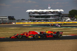 Kimi Raikkonen, Ferrari SH71H and Max Verstappen, Red Bull Racing RB14