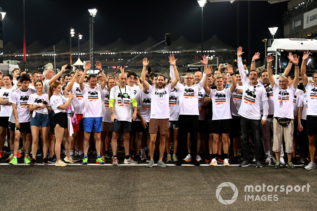 Sebastian Vettel, Aston Martin, is joined on a run around the circuit by team members and well wishers as part of his farewell at his final Grand Prix