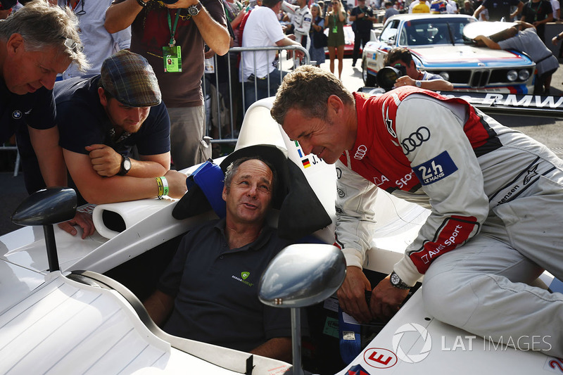 Gerhard Berger, seated in a 1999 BMW V12 LMR sportscar with Tom Kristensen