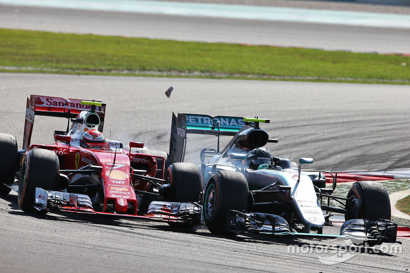 (L to R): Kimi Raikkonen, Ferrari SF16-H and Nico Rosberg, Mercedes AMG F1 W07 Hybrid make contact as they battle for position