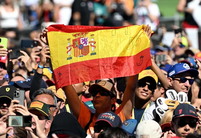 Fans wave Spanish flags