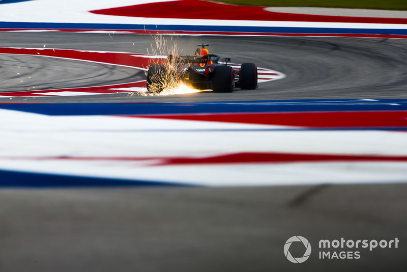 Sparks fly from the rear of Daniel Ricciardo, Red Bull Racing RB14