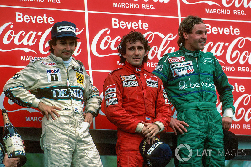 Podium: race winner Alain Prost, second place Nelson Piquet, third place Gerhard Berger