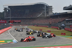 Sebastian Vettel, Ferrari SF71H leads at the start of the race
