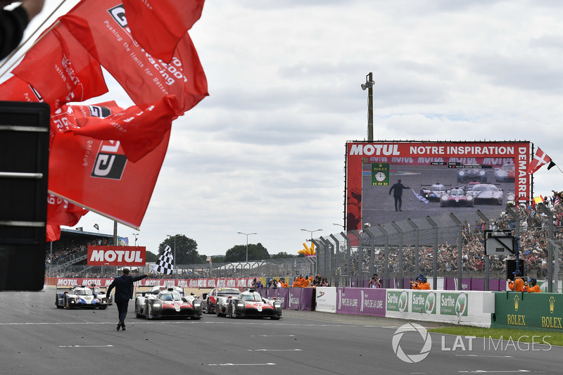 #8 Toyota Gazoo Racing Toyota TS050: Sébastien Buemi, Kazuki Nakajima, Fernando Alonso crosses he finish line with #7 Toyota Gazoo Racing Toyota TS050: Mike Conway, Kamui Kobayashi, Jose Maria Lopez at the checkered flag for the win