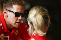 Sebastian Vettel, Ferrari, talking to his press officer
