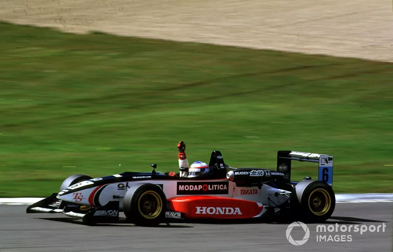 2001 British Formula ThreeDonington, England. 29th April 2001.Race 1 winner Takuma Sato (Carlin Motorsport) raises his arm in victory.World Copyright: Peter Spinney/LAT Photographicref:35mm Image A06