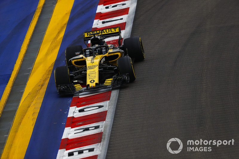 Nico Hulkenberg, Renault Sport F1 Team R.S. 18, runs wide over a kerb and strikes up sparks
