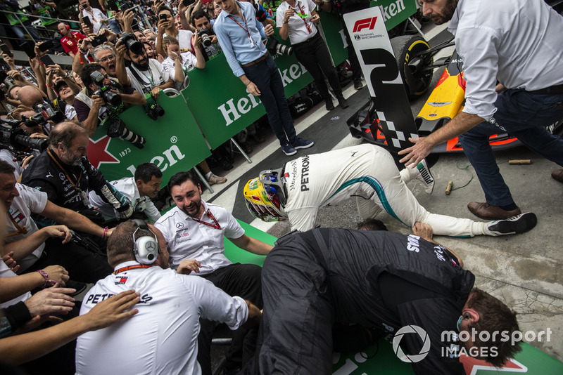 Barriers collapse as Lewis Hamilton, Mercedes AMG F1 celebrates with his mechanics in Parc Ferme 