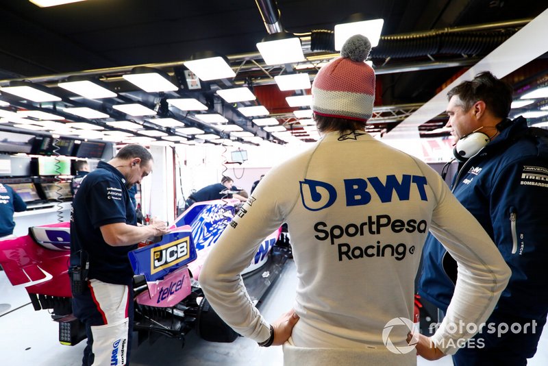 Lance Stroll, Racing Point, talks to Andy Stevenson, Sporting Director, Racing Point, in the team's garage