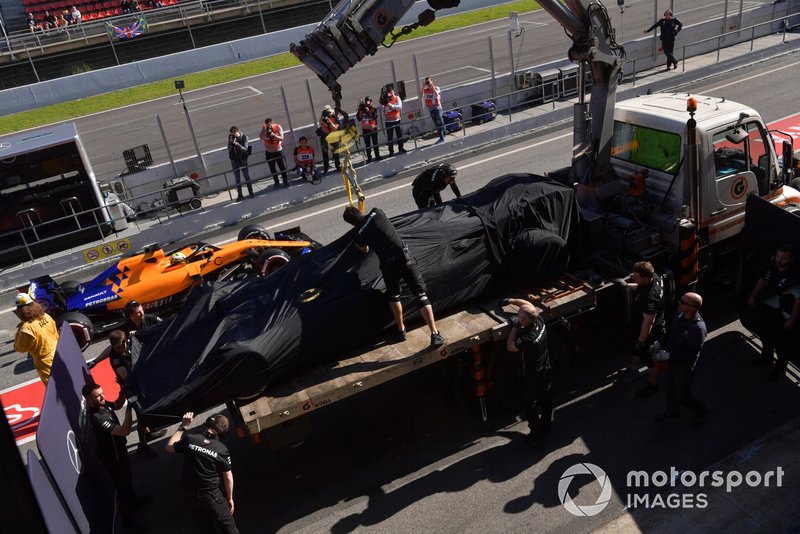 The car of Valtteri Bottas, Mercedes-AMG F1 W10 is recovered to the pits