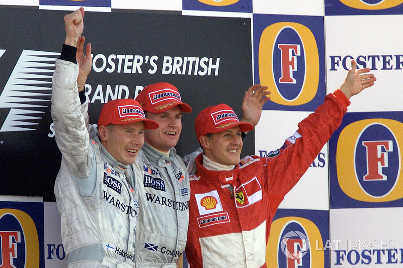 Podium: winner David Coulthard, McLaren, second place Mika Hakkinen, McLaren, third place Michael Sc