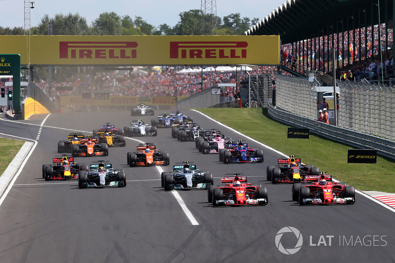 Sebastian Vettel, Ferrari SF70-H leads Kimi Raikkonen, Ferrari SF70-H at the start of the race