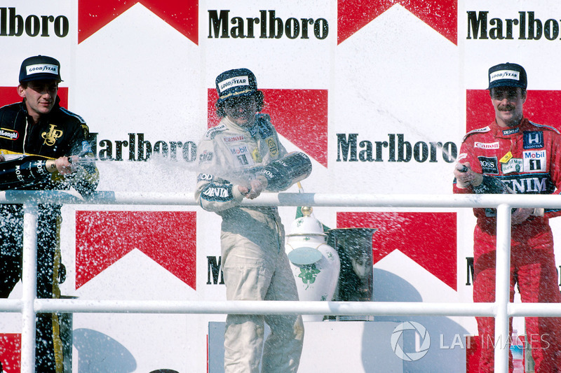 Podium: Race winner Nelson Piquet, Williams, second place Ayrton Senna, Lotus, third place Nigel Mansell, Williams