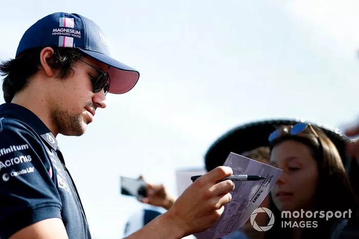 Lance Stroll, Racing Point signs a autograph for a fan 
