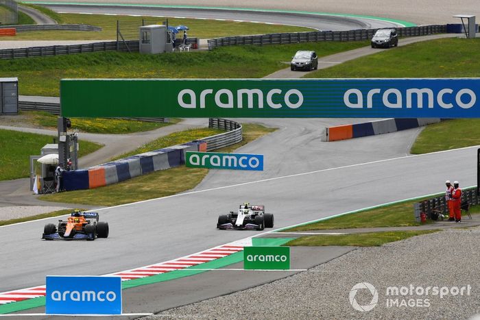 Lando Norris, McLaren MCL35M, Mick Schumacher, Haas VF-21