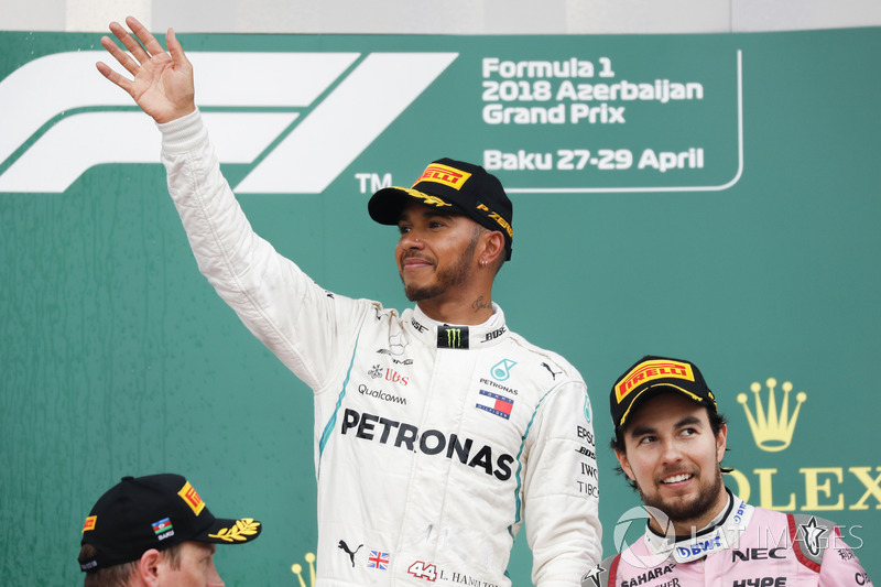 Kimi Raikkonen, Ferrari, 2nd position, Lewis Hamilton, Mercedes AMG F1, 1st position, and Sergio Perez, Force India, 3rd position, on the podium