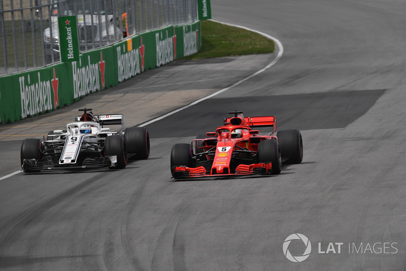 Sebastian Vettel, Ferrari SF71H and Marcus Ericsson, Sauber C37