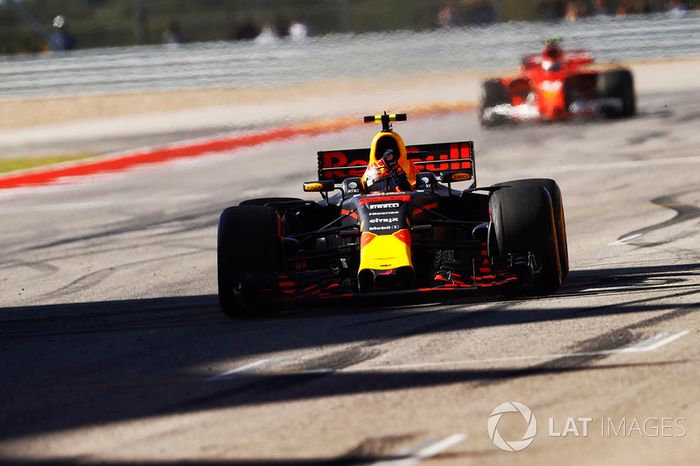 Max Verstappen, Red Bull Racing RB13, celebrates as he crosses the line ahead of Kimi Raikkonen, Ferrari SF70H