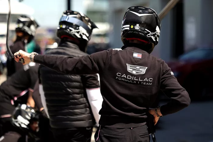 Cadillac F1 Team pit crew in the pit lane.