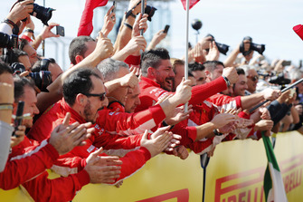 The Ferrari team cheer as Kimi Raikkonen, Ferrari SF71H, 1st position, arrives in Parc Ferme