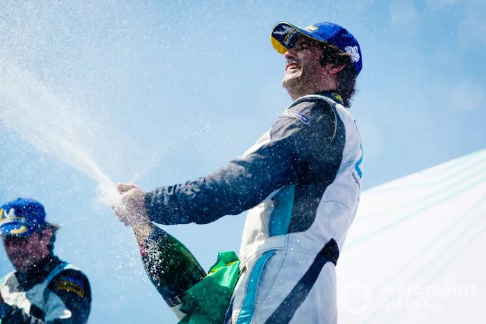 Race winner Sérgio Jimenez, Jaguar Brazil Racing celebrates with the champagne on the podium