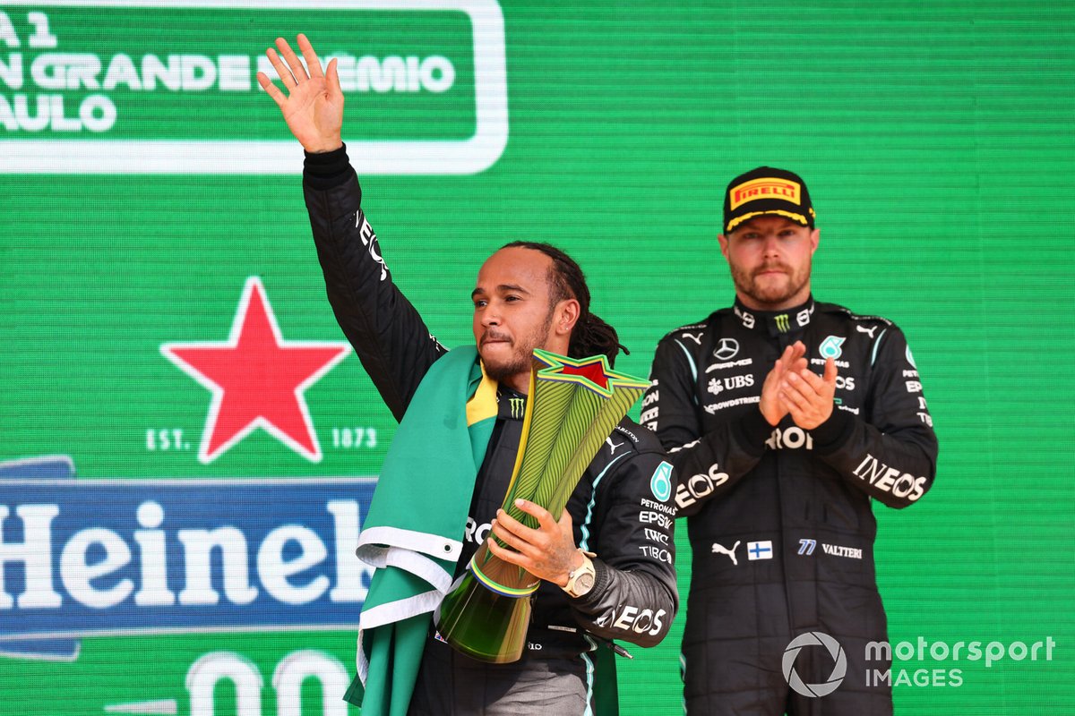 Lewis Hamilton, Mercedes, 1st position, celebrates on the podium with his trophy