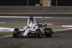 Lance Stroll, Williams FW40, climbs out of his damaged car after a collision with Carlos Sainz Jr., Scuderia Toro Rosso