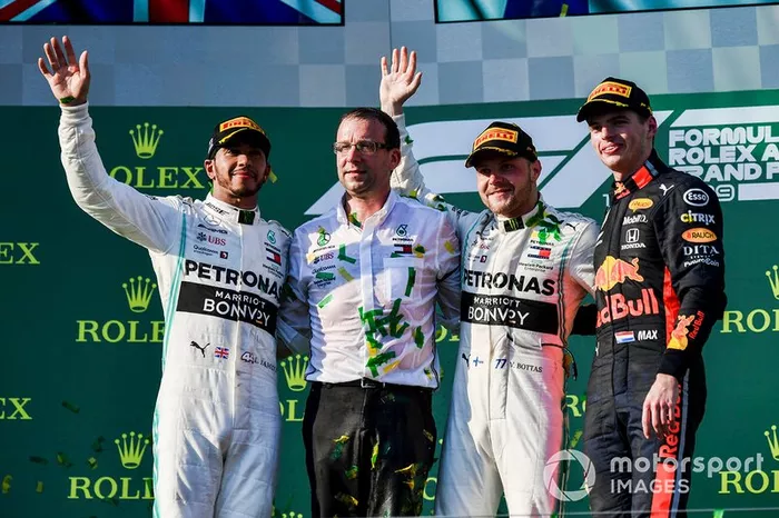 Lewis Hamilton, Mercedes AMG F1, 2nd position, the Mercedes Constructors delegate, Valtteri Bottas, Mercedes AMG F1, 1st position, and Max Verstappen, Red Bull Racing, 3rd position, on the podium