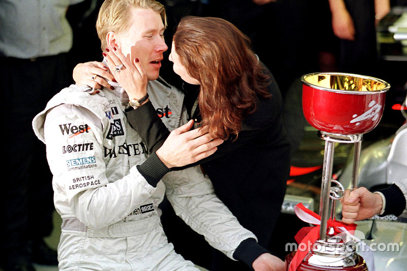 Mika Hakkinen, McLaren kisses his wife Erja after winning the Formula One World Championship