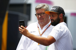 Ross Brawn, Managing Director of Motorsports, FOM, poses for a selfie with a fan