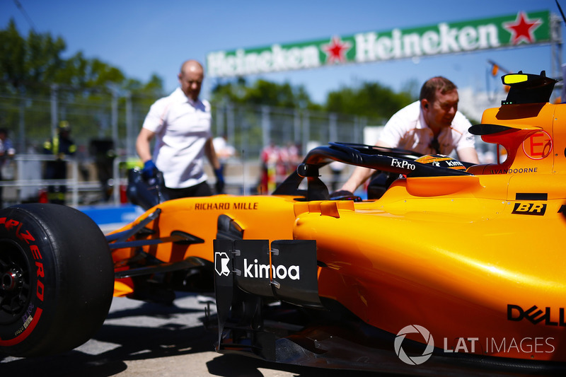 Stoffel Vandoorne, McLaren, is wheeled into his pit garage.
