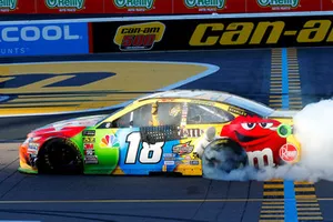 Kyle Busch, Joe Gibbs Racing, Toyota Camry M&M's celebrates his win with a burnout