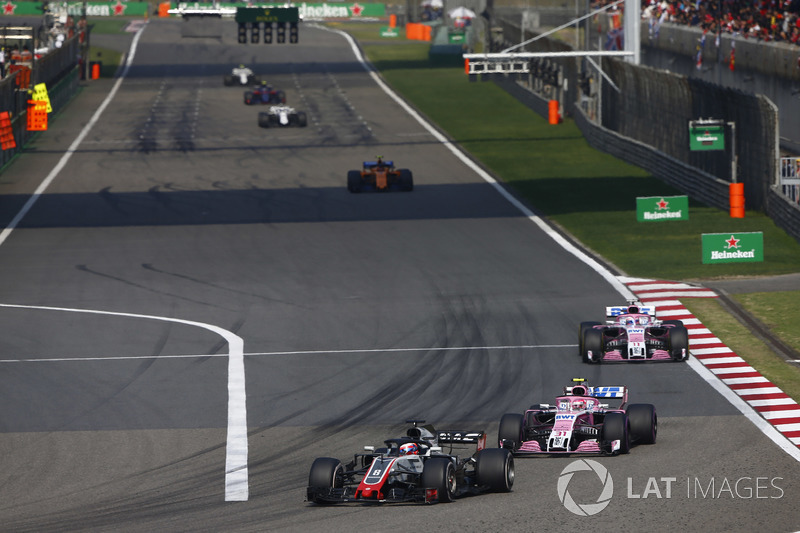 Romain Grosjean, Haas F1 Team VF-18 Ferrari,leads Esteban Ocon, Force India VJM11 Mercedes, and Sergio Perez, Force India VJM11 Mercedes