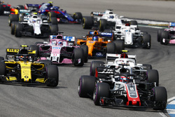 Romain Grosjean, Haas F1 Team VF-18, leads Carlos Sainz Jr., Renault Sport F1 Team R.S. 18, Charles Leclerc, Sauber C37, Sergio Perez, Force India VJM11, and Fernando Alonso, McLaren MCL33