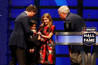 Rick Hendrick, Leo Gordon and Ella Gordon present a ring to Jeff Gordon