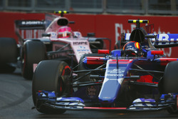 Carlos Sainz Jr., Scuderia Toro Rosso STR12, leads Esteban Ocon, Force India VJM10