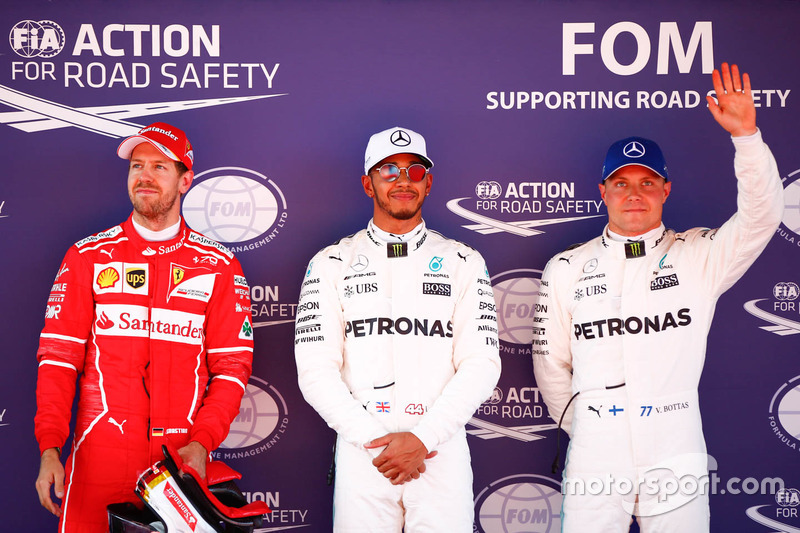 Polesitter Lewis Hamilton, Mercedes AMG F1, second place, Sebastian Vettel, Ferrari, third place Val